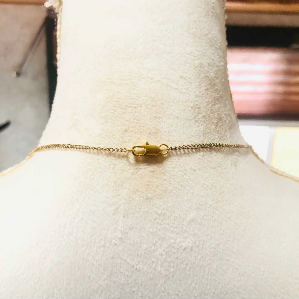 Shiny gold waterfall articulated pendant on chain necklace